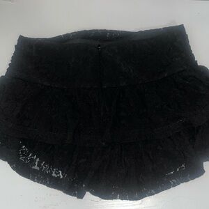 Black Lace mini skirt with built in shorts. Size XS from cider.